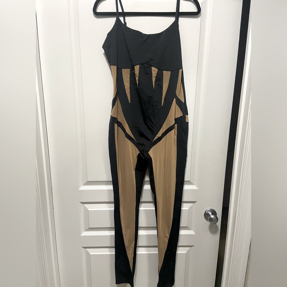 Jumpsuit with sheer accents.